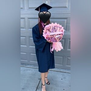 Graduation cap and gown with tassel and sash